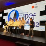 DefCamp 2022 DCTF-Wettbewerbssieg für das Team „The Few Chosen“, das auch aus Studierenden der Fakultät für Mathematik und Informatik besteht